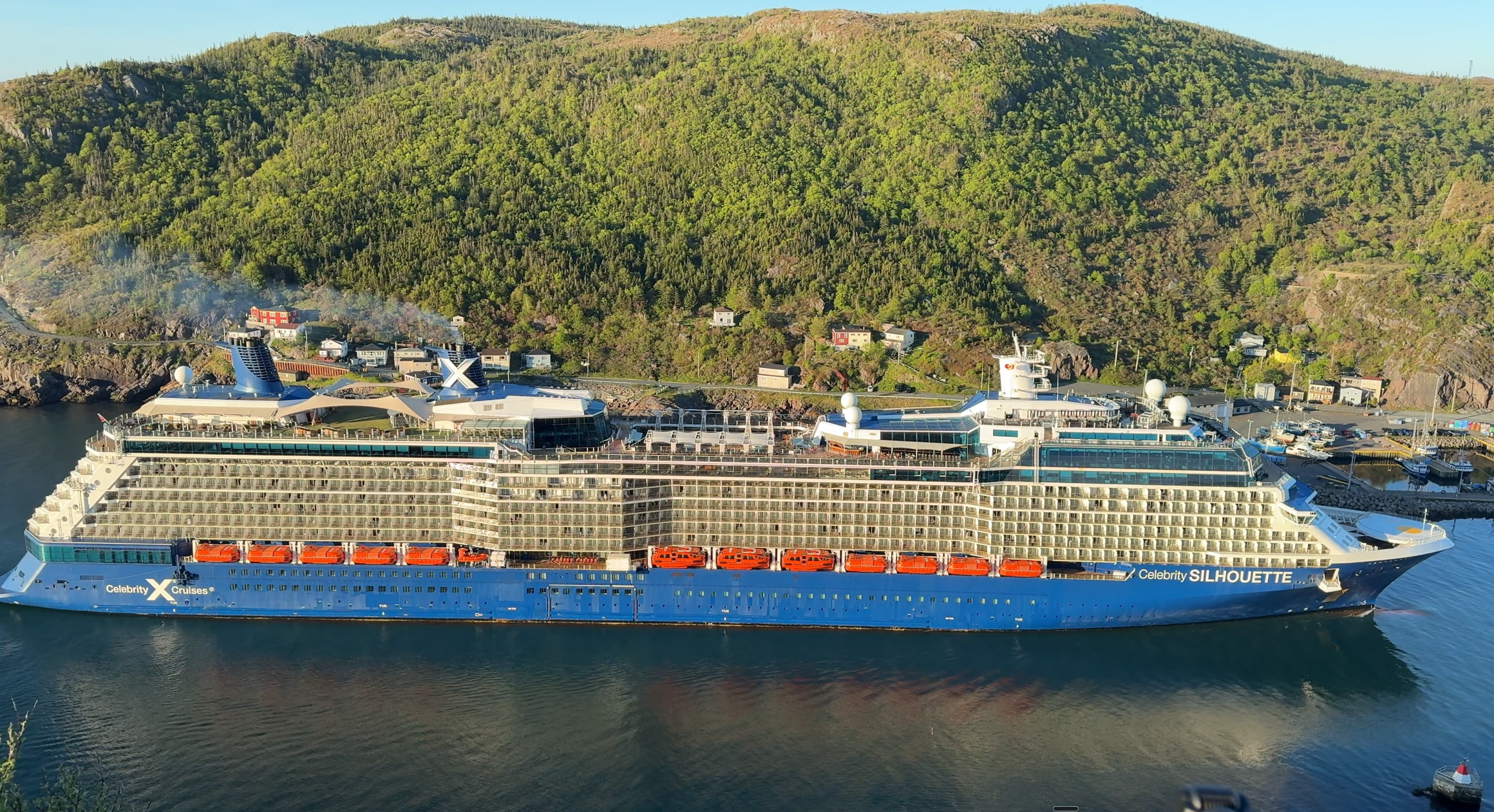 Celebrity Silhouette in St. John's harbour beneath the hills of the Narrows